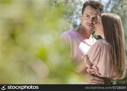 Young loving couple spending quality time in park