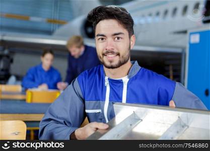 young male airplane assembler posing