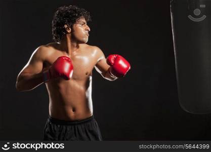 Young male boxer training