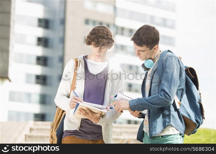 Young male college students studying at campus