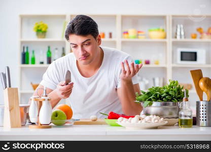 Young male cook working in the kitchen