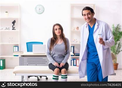 Young male doctor and female beautiful patient 