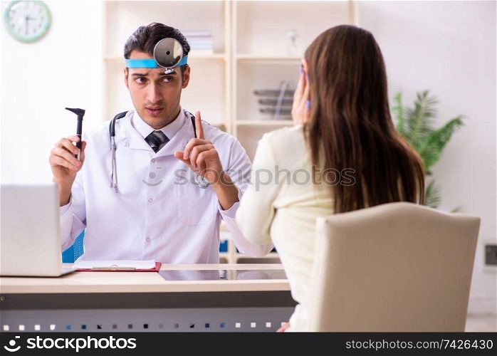 Young male doctor and female beautiful patient 