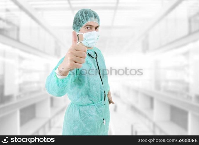 young male doctor at the hospital going thumb up