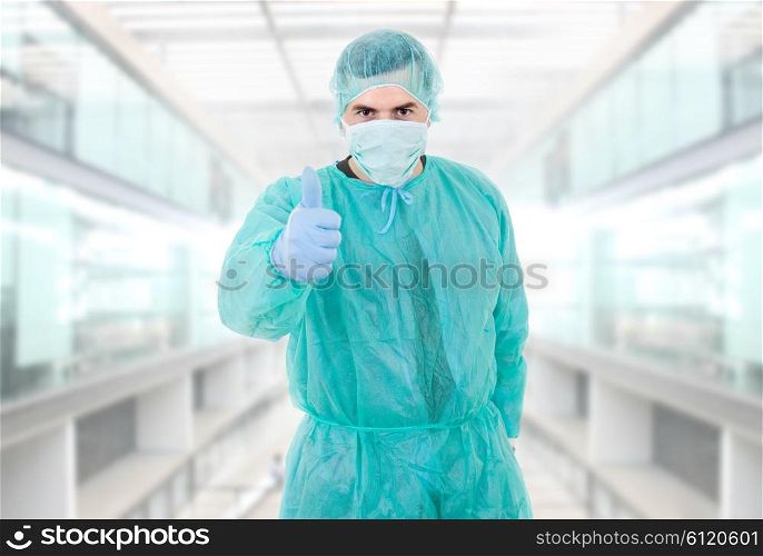 young male doctor at the hospital going thumb up