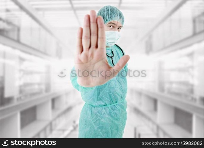 young male doctor going stop with his hand at the hospital