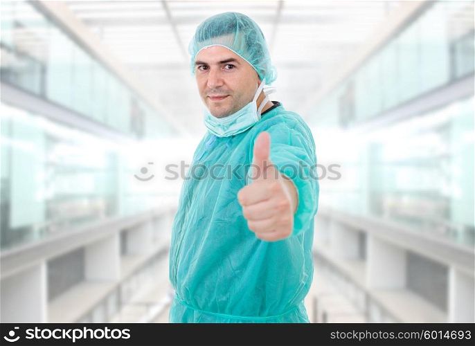 young male doctor going thumb up, at the hospital