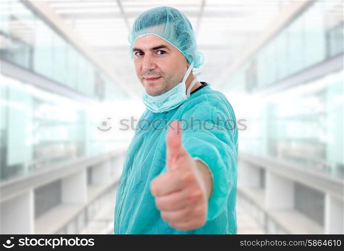 young male doctor going thumbs up