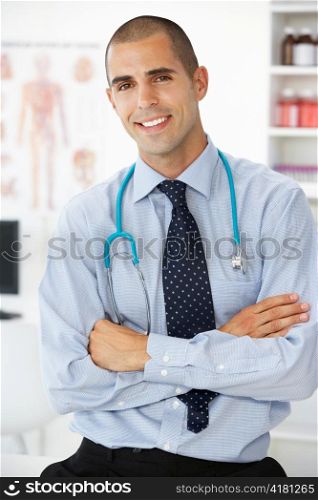 Young male doctor in consulting room