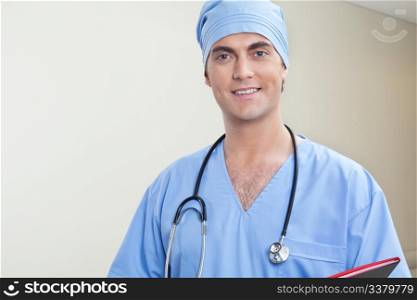 Young male doctor in hospital corridor