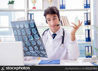 Young male doctor in telehealth concept