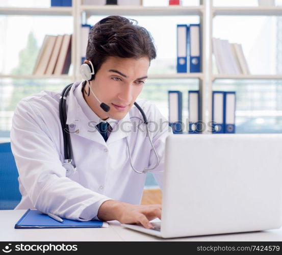 Young male doctor in telehealth concept