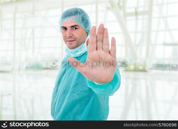 young male doctor making stop with his hand