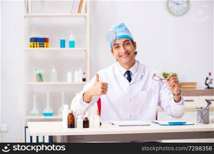 Young male doctor otolaryngologist working at the hospital 