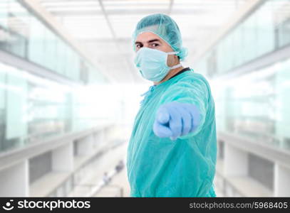 young male doctor pointing, at the hospital