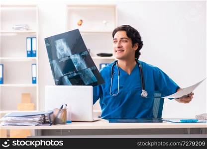 Young male doctor radiologist working at the clinic 