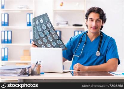 Young male doctor radiologist working at the clinic 