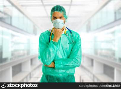 young male doctor thinking, at the hospital