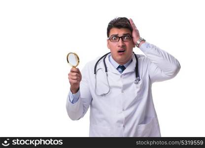 Young male doctor with a looking magnifying glass isolated on wh. Young male doctor with a looking magnifying glass isolated on white background