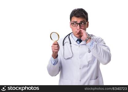 Young male doctor with a looking magnifying glass isolated on wh. Young male doctor with a looking magnifying glass isolated on white background