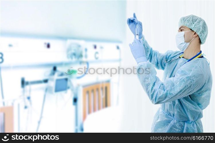 young male doctor with a syringe at the hospital