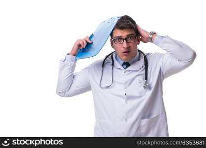 Young male doctor with a writing board isolated on white backgro. Young male doctor with a writing board isolated on white background
