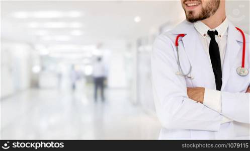 Young male doctor working at the hospital. Medical healthcare and doctor staff service.