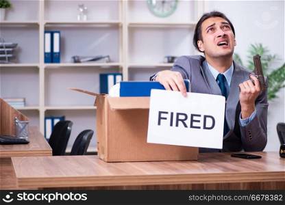 Young male employee being fired from his work 