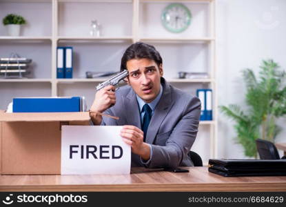 Young male employee being fired from his work 