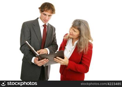 Young male employee showing his female boss the latest report. Isolated on white.