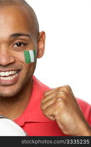 Young Male Football Fan With Nigerian Flag Painted On Face