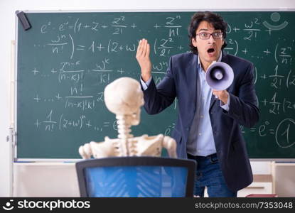 Young male math teacher and student skeleton 