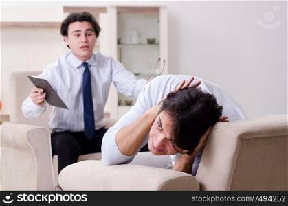 Young male patient discussing with psychologist personal problems. Young male patient discussing with psychologist personal problem