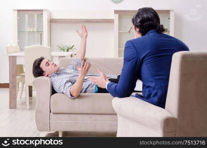 Young male patient discussing with psychologist personal problems. Young male patient discussing with psychologist personal problem