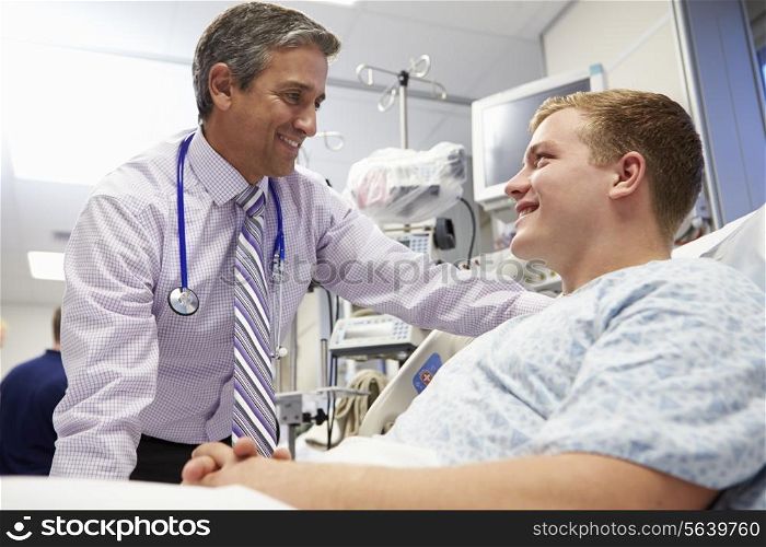 Young Male Patient Talking To Consultant In Emergency Room