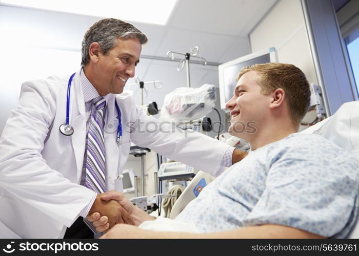 Young Male Patient Talking To Doctor In Emergency Room