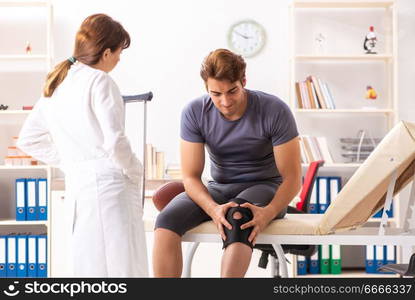 Young male patient visiting female doctor traumatologist 