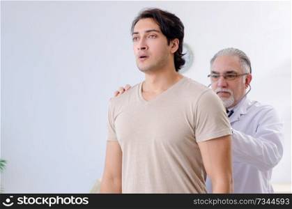 Young male patient visiting old doctor