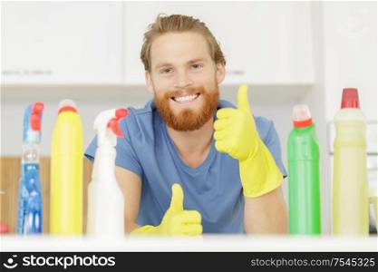 young male professional cleaner with thumb up
