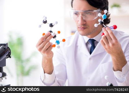 Young male scientist working in the lab 