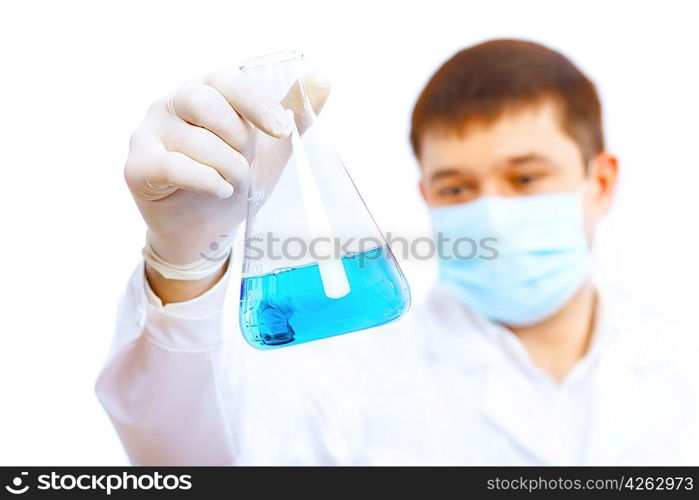 Young male scientist working with liquids in laboratory