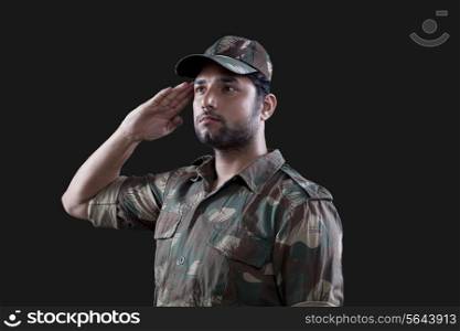 Young male soldier saluting