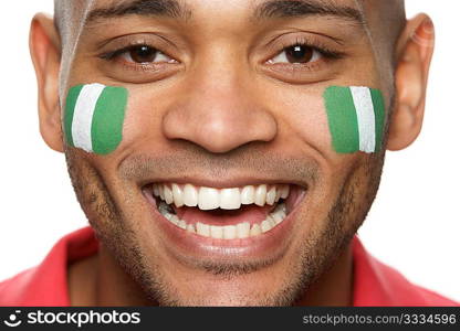 Young Male Sports Fan With Nigerian Flag Painted On Face