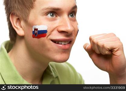 Young Male Sports Fan With Slovakian Flag Painted On Face