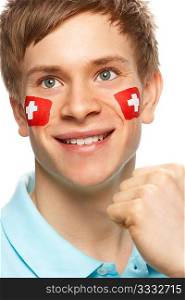 Young Male Sports Fan With Swiss Flag Painted On Face