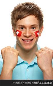 Young Male Sports Fan With Swiss Flag Painted On Face