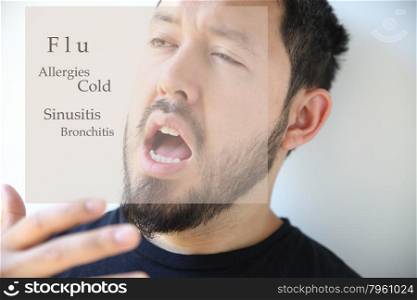 young man about to sneeze into his hand