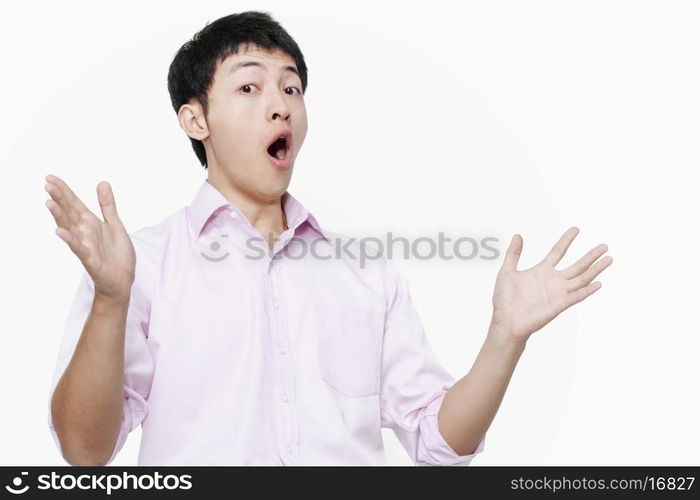 Young man acting surprised