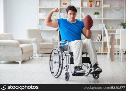 Young man american football player recovering on wheelchair