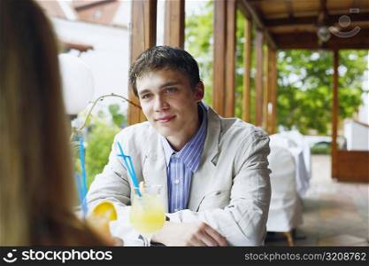 Young man and a woman sitting in a restaurant